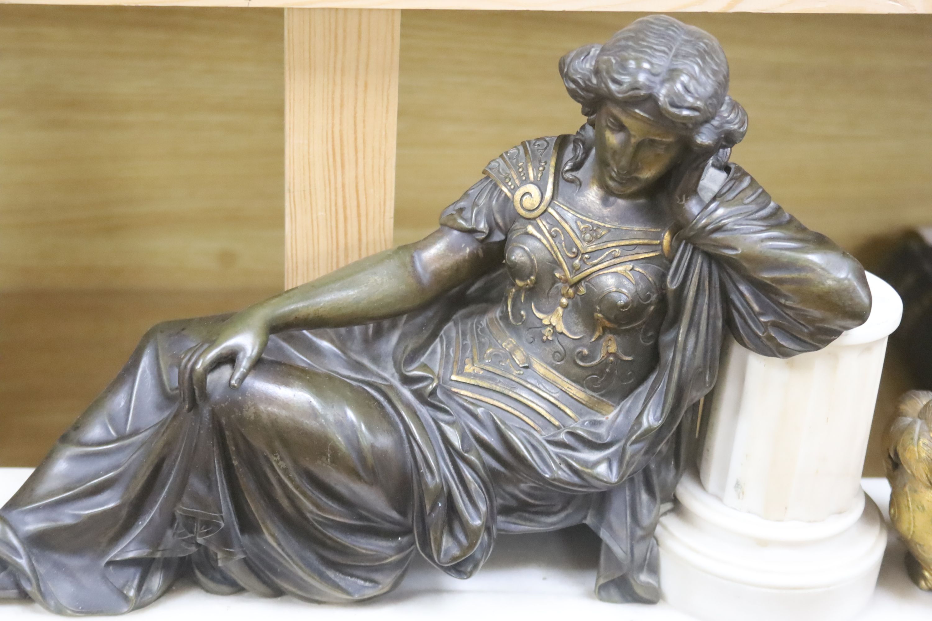 A 19th century gilt metal and marble figural mantel clock, length 58cm